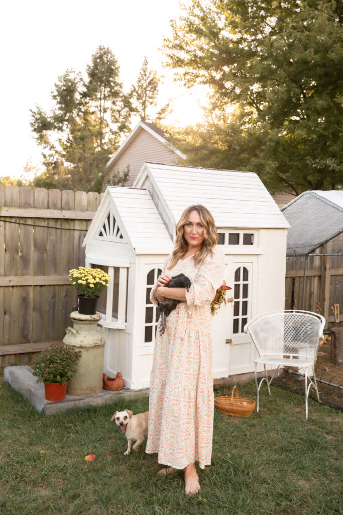 woman holding a chicken